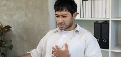 Person experiencing chest burning sensation due to acidity