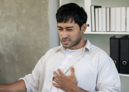 Person experiencing chest burning sensation due to acidity