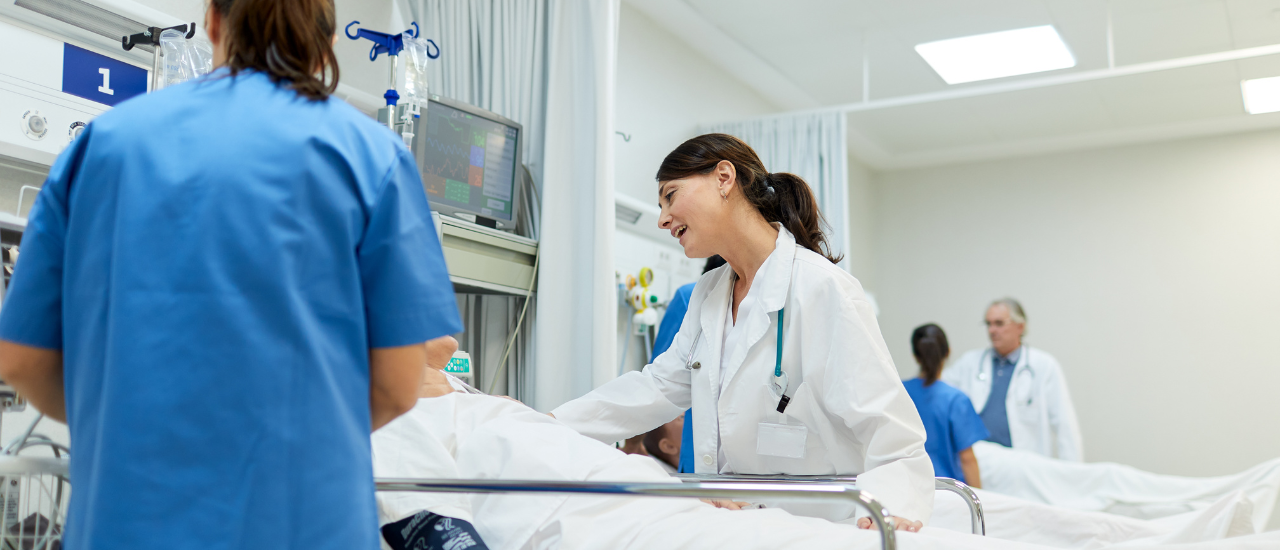 Doctor checking surgical wound dressing after operation