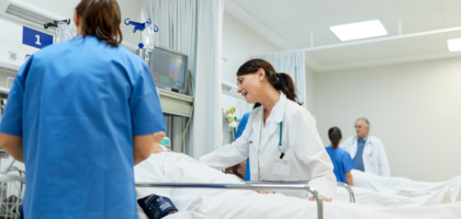 Doctor checking surgical wound dressing after operation