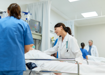 Doctor checking surgical wound dressing after operation