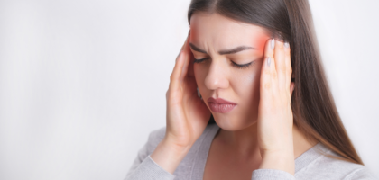 Woman suffering from migraine headache